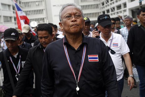 Protest leader and former deputy prime minister Suthep Thaugsuban (C) walks in the Finance Ministry compound after anti-government protester Protest leader and former deputy prime minister Suthep Thaugsuban (C) walks in the Finance Ministry compound after anti-government protester