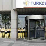 A man walks past the Turkcell head office in Istanbul May 14, 2009. REUTERS/Osman Orsal A man walks past the Turkcell head office in Istanbul May 14, 2009. REUTERS/Osman Orsal