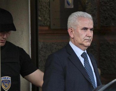 Members of the special police arrest President of Bosnia's autonomous Muslim-Croat federation Zivko Budimir (R) in Sarajevo April 26, 2013. Members of the special police arrest President of Bosnia's autonomous Muslim-Croat federation Zivko Budimir (R) in Sarajevo April 26, 2013.