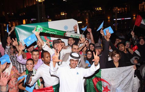 People celebrate after Dubai won the right to host the 2020 World Expo, in front of the Burj Khalifa in Dubai November 27, 2013. REUTERS/Moh People celebrate after Dubai won the right to host the 2020 World Expo, in front of the Burj Khalifa in Dubai November 27, 2013. REUTERS/Moh