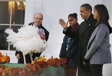 U.S. President Barack Obama joins his daughters Sasha (3rd R) and Malia (R) as they pardon National Thanksgiving Turkey "Popcorn", on the 66 U.S. President Barack Obama joins his daughters Sasha (3rd R) and Malia (R) as they pardon National Thanksgiving Turkey "Popcorn", on the 66
