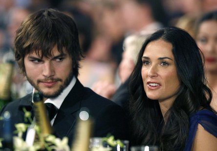 Actor Ashton Kutcher (L) sits with wife actress Demi Moore (R) at the 13th Annual Screen Actors Guild Awards in Los Angeles January 28, 2007 Actor Ashton Kutcher (L) sits with wife actress Demi Moore (R) at the 13th Annual Screen Actors Guild Awards in Los Angeles January 28, 2007