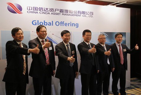 (L-R) China Cinda Asset Management Co Ltd Vice President Gu Jianguo, Vice President Xu Zhichao, Chairman Hou Jianhang, President Zang Jianfa (L-R) China Cinda Asset Management Co Ltd Vice President Gu Jianguo, Vice President Xu Zhichao, Chairman Hou Jianhang, President Zang Jianfa