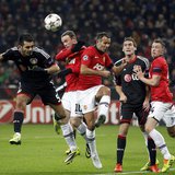 Bayer Leverkusen's Emir Spahic (L) is challenged by Manchester United's Wayne Rooney (2nd L) and Ryan Giggs (3rd L) during their Champions L Bayer Leverkusen's Emir Spahic (L) is challenged by Manchester United's Wayne Rooney (2nd L) and Ryan Giggs (3rd L) during their Champions L