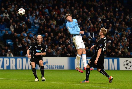 Manchester City's Edin Dzeko (2nd R) heads to score to score during their Champions League soccer match against Viktoria Plzen at the Etihad Manchester City's Edin Dzeko (2nd R) heads to score to score during their Champions League soccer match against Viktoria Plzen at the Etihad