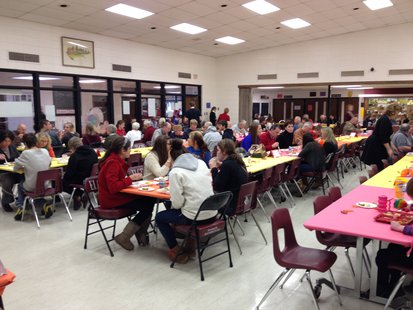 Students of Elkhart Lake-Glenbeulah High School and their grandparents enjoy a Thanksgiving meal together. Students of Elkhart Lake-Glenbeulah High School and their grandparents enjoy a Thanksgiving meal together.