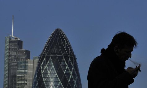 A worker smokes a cigar in the City of London February 9, 2011. REUTERS/Toby Melville A worker smokes a cigar in the City of London February 9, 2011. REUTERS/Toby Melville