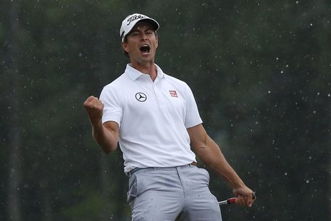 Adam Scott of Australia celebrates sinking a birdie putt on the 18th green during the final round in the 2013 Masters golf tournament at the Adam Scott of Australia celebrates sinking a birdie putt on the 18th green during the final round in the 2013 Masters golf tournament at the