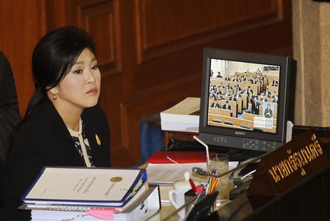 Thailand's Prime Minister Yingluck Shinawatra listens to a debate by the opposition in parliament in Bangkok November 26, 2013. REUTERS/Chai Thailand's Prime Minister Yingluck Shinawatra listens to a debate by the opposition in parliament in Bangkok November 26, 2013. REUTERS/Chai