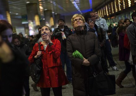 Travelers wait at Pennsylvania Station in New York November 27, 2013. A wintry blast of heavy rain, wind and snow across the eastern United Travelers wait at Pennsylvania Station in New York November 27, 2013. A wintry blast of heavy rain, wind and snow across the eastern United