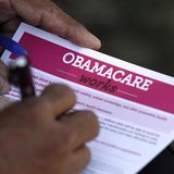 A man fills out an information card during an Affordable Care Act outreach event hosted by Planned Parenthood for the Latino community in Lo A man fills out an information card during an Affordable Care Act outreach event hosted by Planned Parenthood for the Latino community in Lo