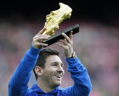 Barcelona's soccer player Lionel Messi poses with the Golden Boot trophy before their Spanish first division league match against Granada at Barcelona's soccer player Lionel Messi poses with the Golden Boot trophy before their Spanish first division league match against Granada at