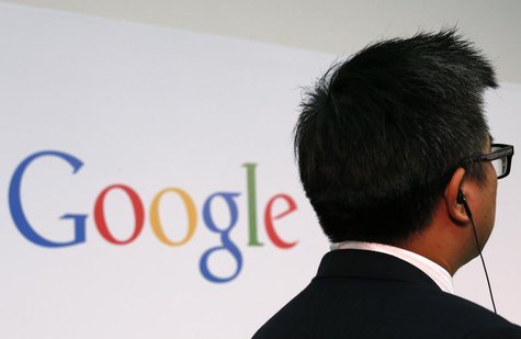 A man stands in front of a Google logo before a talk titled "Connecting with the World Empowering Young Entrepreneurs for the New Digital Ag A man stands in front of a Google logo before a talk titled "Connecting with the World Empowering Young Entrepreneurs for the New Digital Ag