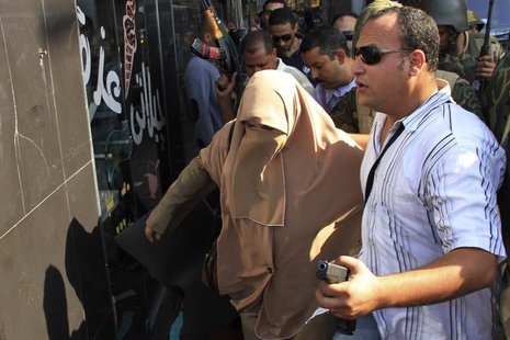 Security forces arrest a pro-Mursi female protester during clashes in Alexandria November 1, 2013. REUTERS/Stringer Security forces arrest a pro-Mursi female protester during clashes in Alexandria November 1, 2013. REUTERS/Stringer
