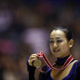 Mao Asada of Japan poses with her gold medal during the award ceremony for the women's free skating programme at the ISU Grand Prix of Figur Mao Asada of Japan poses with her gold medal during the award ceremony for the women's free skating programme at the ISU Grand Prix of Figur
