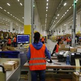 Workers handle items for delivery at Amazon's new distribution center in Brieselang, near Berlin November 28, 2013. REUTERS/Tobias Schwarz Workers handle items for delivery at Amazon's new distribution center in Brieselang, near Berlin November 28, 2013. REUTERS/Tobias Schwarz