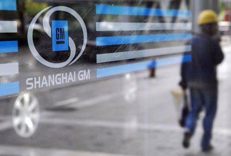 A labourer is reflected in the glass of a Shanghai General Motors exhibition hall in Shanghai May 28, 2009. REUTERS/Stringer A labourer is reflected in the glass of a Shanghai General Motors exhibition hall in Shanghai May 28, 2009. REUTERS/Stringer