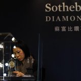 A member of staff checks a display prior to the exhibition sale of Sotheby's Diamonds during Sotheby's Beijing Art Week in Beijing, November A member of staff checks a display prior to the exhibition sale of Sotheby's Diamonds during Sotheby's Beijing Art Week in Beijing, November