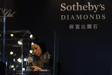 A member of staff checks a display prior to the exhibition sale of Sotheby's Diamonds during Sotheby's Beijing Art Week in Beijing, November A member of staff checks a display prior to the exhibition sale of Sotheby's Diamonds during Sotheby's Beijing Art Week in Beijing, November