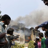 Garment workers gather in front of the Standard Group garment factory which was on fire in Gazipur November 29, 2013. REUTERS/Andrew Biraj Garment workers gather in front of the Standard Group garment factory which was on fire in Gazipur November 29, 2013. REUTERS/Andrew Biraj