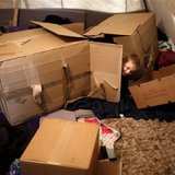 A Muslim Bosniak child plays amongst boxes in a camp in Sarajevo, November 19, 2013. REUTERS/Dado Ruvic A Muslim Bosniak child plays amongst boxes in a camp in Sarajevo, November 19, 2013. REUTERS/Dado Ruvic