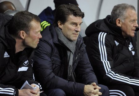 Swansea's manager Michael Laudrup (C) during their Europa League soccer match against Valencia at the Liberty Stadium in Swansea, Wales, Nov Swansea's manager Michael Laudrup (C) during their Europa League soccer match against Valencia at the Liberty Stadium in Swansea, Wales, Nov