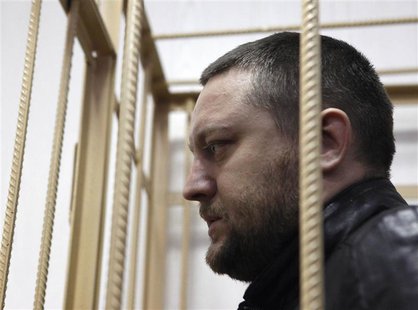 Yury Zarutsky looks out from the defendant's holding cell during a court hearing in Moscow in this March 7, 2013 file photo. REUTERS/Maxim S Yury Zarutsky looks out from the defendant's holding cell during a court hearing in Moscow in this March 7, 2013 file photo. REUTERS/Maxim S