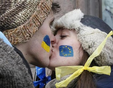 Students kiss as they stand on a street to form a human chain from the Ukrainian capital to the western border during a demonstration in sup Students kiss as they stand on a street to form a human chain from the Ukrainian capital to the western border during a demonstration in sup