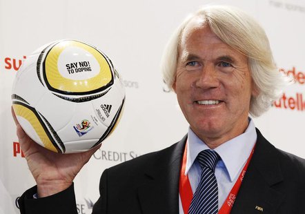 Jiri Dvorak, Chief Medical Officer of the FIFA poses for photographers as he presents a ball with the lettering "SAY NO! TO DOPING" during a Jiri Dvorak, Chief Medical Officer of the FIFA poses for photographers as he presents a ball with the lettering "SAY NO! TO DOPING" during a