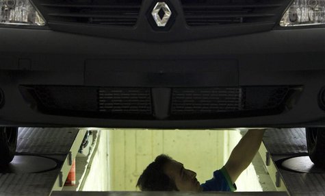 An employee works at Iran Khodro's joint venture assembly plant to produce the Tondar (Renault's Logan) car in the west of Tehran in this Se An employee works at Iran Khodro's joint venture assembly plant to produce the Tondar (Renault's Logan) car in the west of Tehran in this Se