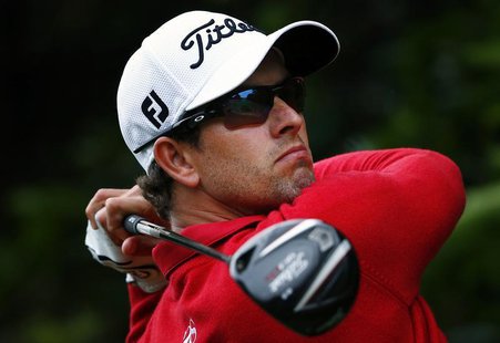 Australia's Adam Scott hits a drive on the second hole during the second round of the Australian Open golf tournament at Royal Sydney Golf C Australia's Adam Scott hits a drive on the second hole during the second round of the Australian Open golf tournament at Royal Sydney Golf C