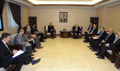 Syrian Foreign Minister Walid al-Muallem (center R) meets Sigrid Kaag (center L), Special Coordinator of the Organisation for the Prohibitio Syrian Foreign Minister Walid al-Muallem (center R) meets Sigrid Kaag (center L), Special Coordinator of the Organisation for the Prohibitio