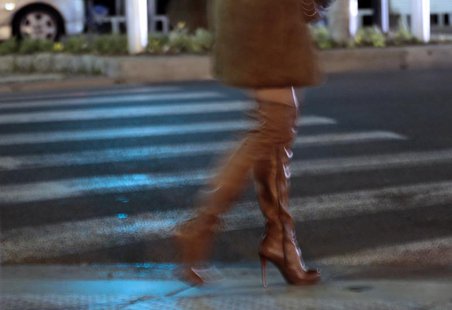 A prostitute from Eastern Europe waits for customers along the Promenade des Anglais in Nice, November 29, 2013. REUTERS/Eric Gaillard A prostitute from Eastern Europe waits for customers along the Promenade des Anglais in Nice, November 29, 2013. REUTERS/Eric Gaillard