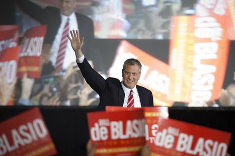 Liberal Democrat Bill de Blasio gestures as he walks onstage during his election victory party at the Park Slope Armory in New York November Liberal Democrat Bill de Blasio gestures as he walks onstage during his election victory party at the Park Slope Armory in New York November