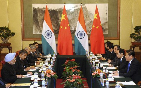 China's President Xi Jinping (R) talks with India's Prime Minister Manmohan Singh (L) during a meeting at the Diaoyutai State Guesthouse in China's President Xi Jinping (R) talks with India's Prime Minister Manmohan Singh (L) during a meeting at the Diaoyutai State Guesthouse in