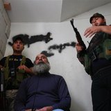 Sunni Muslim fighters stand with their weapons inside a building in Tripoli, northern Lebanon, November 30, 2013. REUTERS/Omar Ibrahim Sunni Muslim fighters stand with their weapons inside a building in Tripoli, northern Lebanon, November 30, 2013. REUTERS/Omar Ibrahim