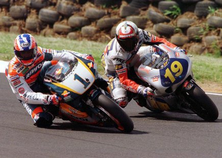 Australia's Michael Doohan (L) leads competitor Doriano Romboni of Italy into a corner during Free Practice for the 500cc Australian Motorcy Australia's Michael Doohan (L) leads competitor Doriano Romboni of Italy into a corner during Free Practice for the 500cc Australian Motorcy