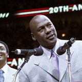 Former Bulls star Michael Jordan (R) talks to the crowd while Scottie Pippen looks on during a ceremony to honor the 20th anniversary of the Former Bulls star Michael Jordan (R) talks to the crowd while Scottie Pippen looks on during a ceremony to honor the 20th anniversary of the