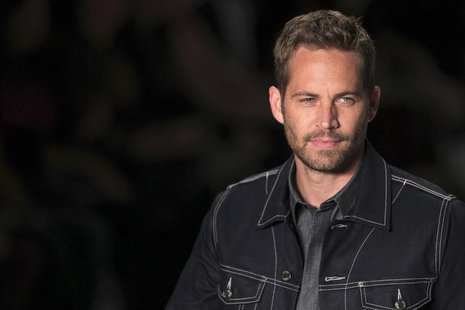 U.S. actor Paul Walker presents a creation from Colcci's 2013/2014 summer collection during Sao Paulo Fashion Week March 21, 2013 file photo U.S. actor Paul Walker presents a creation from Colcci's 2013/2014 summer collection during Sao Paulo Fashion Week March 21, 2013 file photo