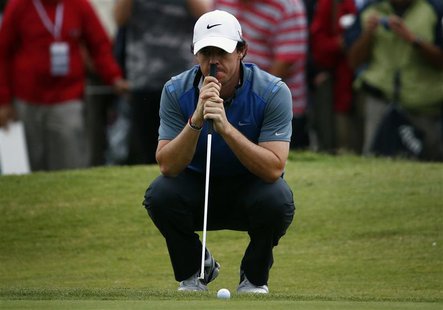 Northern Ireland's Rory McIlroy leans on his putter on the eighth hole during the second round of the Australian Open golf tournament at Roy Northern Ireland's Rory McIlroy leans on his putter on the eighth hole during the second round of the Australian Open golf tournament at Roy