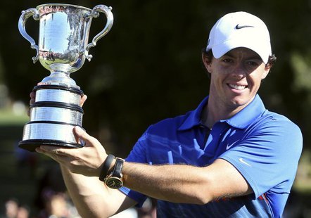 Northern Ireland's Rory McIlroy holds aloft the trophy after winning the Australian Open golf tournament at Royal Sydney Golf Club December Northern Ireland's Rory McIlroy holds aloft the trophy after winning the Australian Open golf tournament at Royal Sydney Golf Club December
