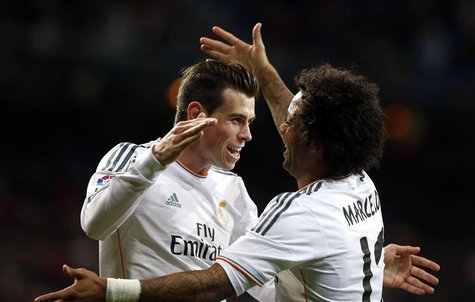 Real Madrid's Gareth Bale (L) celebrates his goal against Real Valladolid with teammate Marcelo during their Spanish First Division soccer m Real Madrid's Gareth Bale (L) celebrates his goal against Real Valladolid with teammate Marcelo during their Spanish First Division soccer m