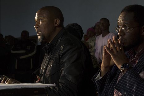 Mandla Mandela (L), grandson of former South African president Nelson Mandela, talks to journalists during a news conference in Mvezo, in th Mandla Mandela (L), grandson of former South African president Nelson Mandela, talks to journalists during a news conference in Mvezo, in th