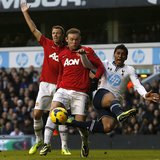 Tottenham Hotspur's Paulinho (R) challenges Manchester United's Wayne Rooney during their English Premier League soccer match at White Hart Tottenham Hotspur's Paulinho (R) challenges Manchester United's Wayne Rooney during their English Premier League soccer match at White Hart