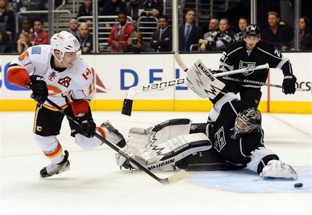 Nov 30, 2013; Los Angeles, CA, USA; Calgary Flames left wing Mike Cammalleri (13) scores the game winning goal past Los Angeles Kings goalie Nov 30, 2013; Los Angeles, CA, USA; Calgary Flames left wing Mike Cammalleri (13) scores the game winning goal past Los Angeles Kings goalie