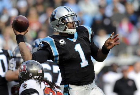 Dec 1, 2013; Charlotte, NC, USA; Carolina Panthers quarterback Cam Newton (1) drops back to pass during the second half of the game against Dec 1, 2013; Charlotte, NC, USA; Carolina Panthers quarterback Cam Newton (1) drops back to pass during the second half of the game against