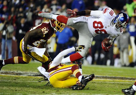 Dec 1, 2013; Landover, MD, USA; New York Giants wide receiver Hakeem Nicks (88) is tackled by Washington Redskins safety Brandon Meriweather Dec 1, 2013; Landover, MD, USA; New York Giants wide receiver Hakeem Nicks (88) is tackled by Washington Redskins safety Brandon Meriweather