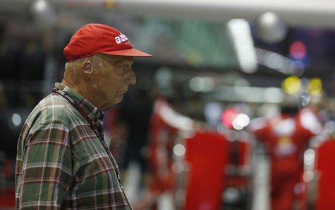 Former Formula One racing driver and three-time F1 World Champion, Niki Lauda of Austria, stands in the pit lane before the start of the Sin Former Formula One racing driver and three-time F1 World Champion, Niki Lauda of Austria, stands in the pit lane before the start of the Sin