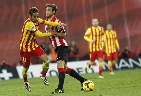 Barcelona's Neymar (L) is challenged by Athletic Bilbao's Carlos Gurpegui (2nd L) during their Spanish first division soccer match at San Ma Barcelona's Neymar (L) is challenged by Athletic Bilbao's Carlos Gurpegui (2nd L) during their Spanish first division soccer match at San Ma
