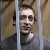 Dancer Pavel Dmitrichenko looks out from the defendant's holding cell during a hearing in Moscow in this October 22, 2013 file photo. REUTER Dancer Pavel Dmitrichenko looks out from the defendant's holding cell during a hearing in Moscow in this October 22, 2013 file photo. REUTER